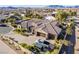 Aerial view of house, large backyard and mountains in background at 8801 Crescent Lake St, Las Vegas, NV 89113