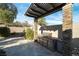 Outdoor kitchen with built-in grill and ample counter space at 8801 Crescent Lake St, Las Vegas, NV 89113