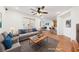 Virtually staged living room features a comfortable seating area and hardwood floors at 9156 Mcginnis Ave, Las Vegas, NV 89148