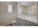 Bathroom with gray vanity, white countertop, and a large mirror at 10079 Dazzling Sunrays Ave # 0, Las Vegas, NV 89129