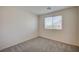 Well-lit bedroom with carpet and a window with blinds at 10079 Dazzling Sunrays Ave # 0, Las Vegas, NV 89129