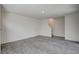 Spacious living room with gray vinyl flooring and stairs at 10079 Dazzling Sunrays Ave # 0, Las Vegas, NV 89129