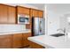 Kitchen with stainless steel appliances and wood cabinets at 1722 Game Garden Rd, North Las Vegas, NV 89031