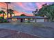 Single-story home with landscaped yard and attached garage at sunset at 2677 S Torrey Pines Dr, Las Vegas, NV 89146