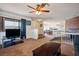 Living room with split level, TV, fireplace and kitchen view at 3609 Woodglen Ct, Las Vegas, NV 89108