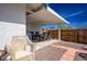 Covered patio with wicker furniture, perfect for outdoor dining at 3609 Woodglen Ct, Las Vegas, NV 89108