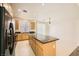 Kitchen features granite countertops and an island at 3917 Javana Ct, Las Vegas, NV 89129