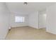 Bright bedroom with tile floors and access to hallway at 4373 Spencer St, Las Vegas, NV 89119