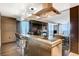 Modern kitchen with stainless steel appliances and breakfast bar at 4381 W Flamingo Rd # 2202, Las Vegas, NV 89103