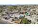 Aerial view of a house with a pool and surrounding neighborhood at 5379 Surrey St, Las Vegas, NV 89119