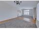 Spacious living room with tile floors and a view into the kitchen at 6118 Evening View St, North Las Vegas, NV 89031