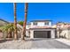 Beautiful two-story home with dark brown garage door and landscaping at 686 Ribbon Grass Ave, Las Vegas, NV 89183