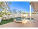 Relaxing backyard with a kidney-shaped pool and patio furniture at 686 Ribbon Grass Ave, Las Vegas, NV 89183