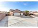 Three-car garage with gated side yard and spacious driveway at 7552 Chambery Cove Ct, Las Vegas, NV 89123