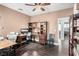 Spacious home office with built-in shelving and wood floors at 7552 Chambery Cove Ct, Las Vegas, NV 89123