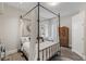 Elegant bedroom with a four-poster bed and built-in wardrobe at 8109 Moonstone Cir, Las Vegas, NV 89128