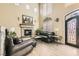 Bright living room featuring a fireplace and elegant entryway at 8508 Vivid Violet Ave, Las Vegas, NV 89143