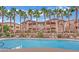 Community pool with surrounding lounge chairs at 8805 Jeffreys St # 1029, Las Vegas, NV 89123