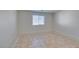 Spacious bedroom with tile flooring and a window at 9927 Keephills St, Las Vegas, NV 89183