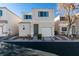 Two-story house with attached garage, front yard and walkway at 9927 Keephills St, Las Vegas, NV 89183