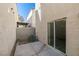 Private patio with concrete flooring and access to the house at 9927 Keephills St, Las Vegas, NV 89183