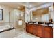 Bathroom with double vanity, shower and tub at 125 E Harmon Ave # 2516, Las Vegas, NV 89109