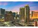 Aerial view of a high-rise building at dusk, showcasing city views at 135 E Harmon Ave # 407, Las Vegas, NV 89109