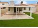 Covered patio with artificial turf and solar panels on the roof at 1420 Daybreak Dr, Las Vegas, NV 89108