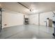 Attached garage with epoxy floor and storage shelving at 1582 Shady Elm St, Las Vegas, NV 89135