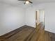 Spacious bedroom with wood-look floors and access to bathroom at 1658 Garden Path Ct, Las Vegas, NV 89119