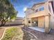 Landscaped backyard with patio and grassy area at 256 Camelback Ridge Ave, Henderson, NV 89012