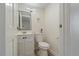 Small bathroom with white vanity, toilet, and a mirror at 3056 Garnet Ct, Las Vegas, NV 89121