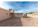 Covered patio area in a gravel backyard with a storage shed at 4002 Redfield Ave, North Las Vegas, NV 89032