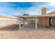 Spacious backyard with covered patio and storage shed at 4002 Redfield Ave, North Las Vegas, NV 89032