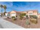 One-story house with a two-car garage and desert landscaping at 4002 Redfield Ave, North Las Vegas, NV 89032