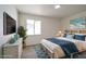 Bright bedroom with light flooring and a large window at 4317 Nolan Ln, Las Vegas, NV 89107