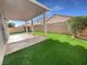 Spacious covered patio and artificial turf lawn at 5647 Deer Run Ct, North Las Vegas, NV 89031