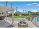 Landscaped backyard with a covered patio and spa at 6125 Resort Ridge St, Las Vegas, NV 89130