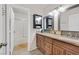 Guest bathroom with a shower/tub combo and wood vanity at 6125 Resort Ridge St, Las Vegas, NV 89130