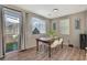 Dining area with table and chairs near sliding door at 6237 Yankee Spring St, Las Vegas, NV 89122