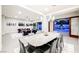 Open concept dining room with pool view and seating for eight at 6865 Hidden Sunset Ln, Las Vegas, NV 89120