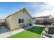 Backyard view of home with artificial turf and patio at 709 Jonathan Glen Way, Las Vegas, NV 89145