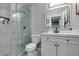 Clean bathroom with white vanity, large mirror, and walk-in shower at 709 Jonathan Glen Way, Las Vegas, NV 89145