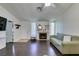 Living room with fireplace and dark hardwood floors at 709 Jonathan Glen Way, Las Vegas, NV 89145