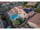 Aerial view showing two-story house with solar panels, pool, and backyard at 755 Maranello St, Henderson, NV 89052