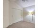 Spacious bedroom with double sliding doors and closet at 7801 Oakstone Ct, Las Vegas, NV 89145