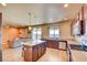 Modern kitchen with island and stainless steel appliances at 9209 Palmer House Ave, Las Vegas, NV 89149