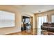 Living room with fireplace, large TV, and sliding glass doors at 10613 Emerald Path Ave, Las Vegas, NV 89166