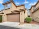 Townhouse with two-car garage and well-manicured landscaping at 11388 Newton Commons Dr # 104, Las Vegas, NV 89135