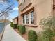 Well-maintained exterior with walkway and manicured landscaping at 11388 Newton Commons Dr # 104, Las Vegas, NV 89135